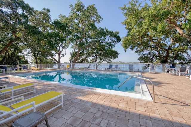 view of swimming pool featuring a patio area