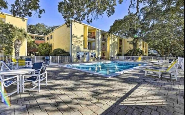 view of swimming pool with a patio area