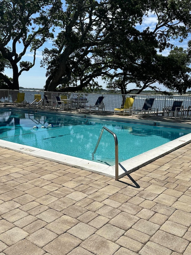 view of swimming pool featuring a patio area