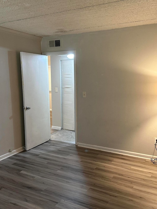 spare room with dark hardwood / wood-style floors