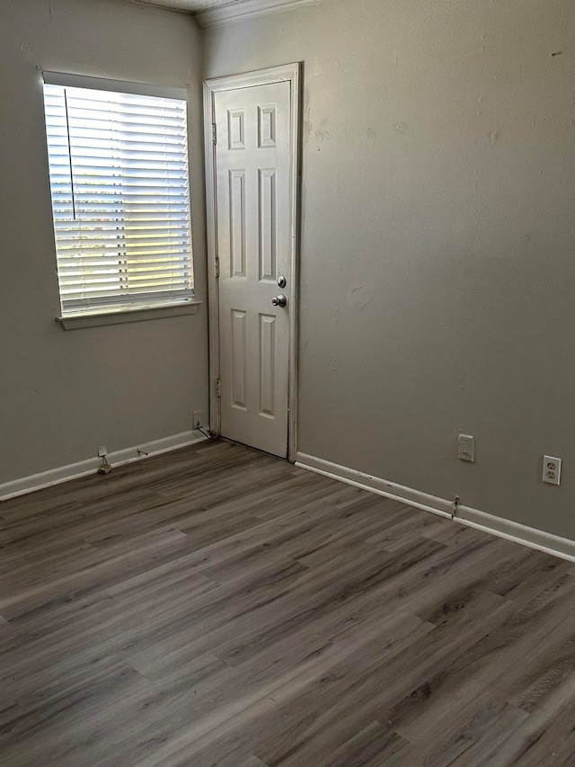 unfurnished room featuring dark hardwood / wood-style flooring