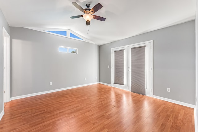 unfurnished bedroom featuring ceiling fan, lofted ceiling, french doors, and light hardwood / wood-style flooring