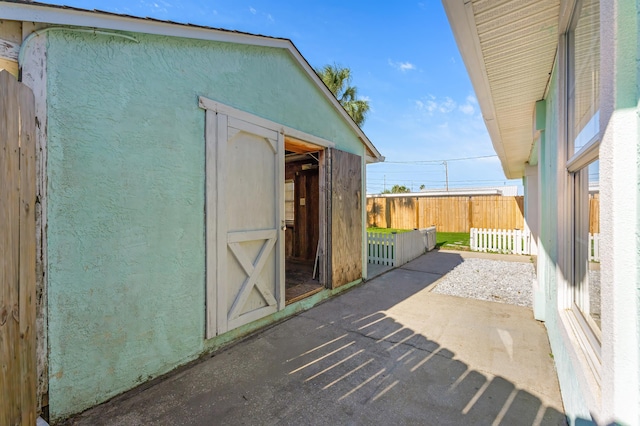 view of patio / terrace with a shed