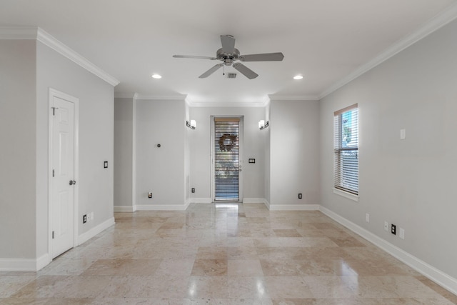 unfurnished room featuring ceiling fan and crown molding