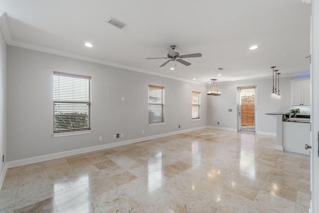 empty room with ceiling fan and crown molding