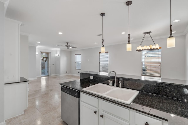 kitchen featuring sink, white cabinets, stainless steel dishwasher, and decorative light fixtures