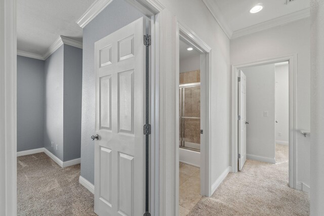 hallway with light carpet and ornamental molding