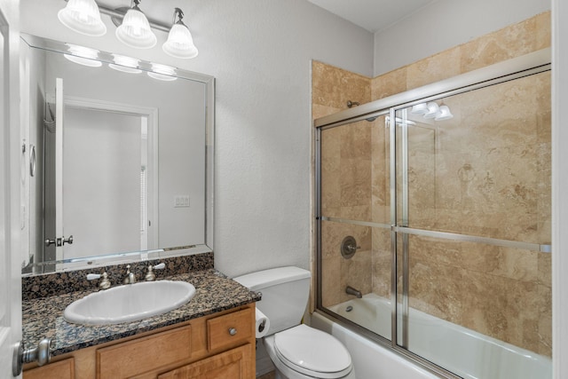 full bathroom featuring vanity, toilet, and enclosed tub / shower combo