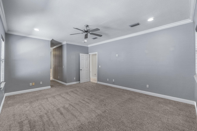 unfurnished room featuring carpet flooring, ceiling fan, and ornamental molding