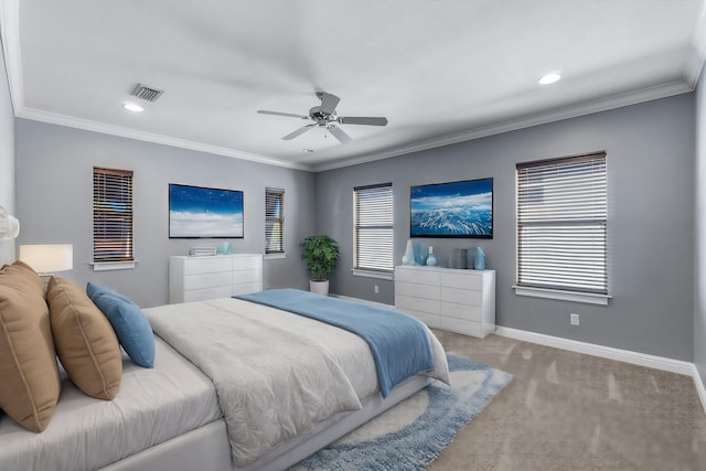 carpeted bedroom with ceiling fan and ornamental molding