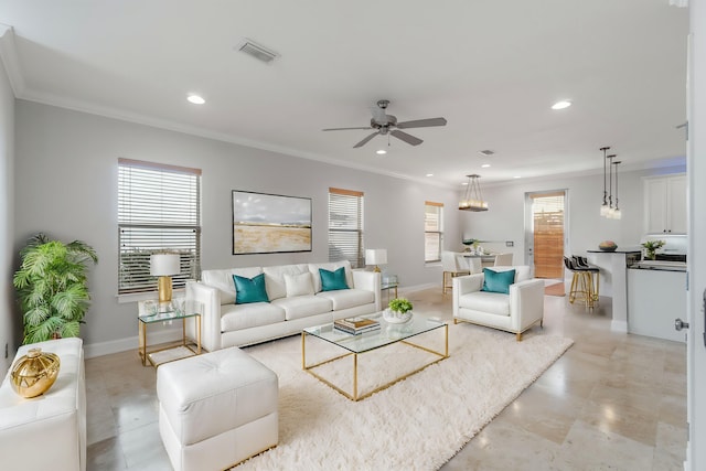 living room featuring ceiling fan and crown molding