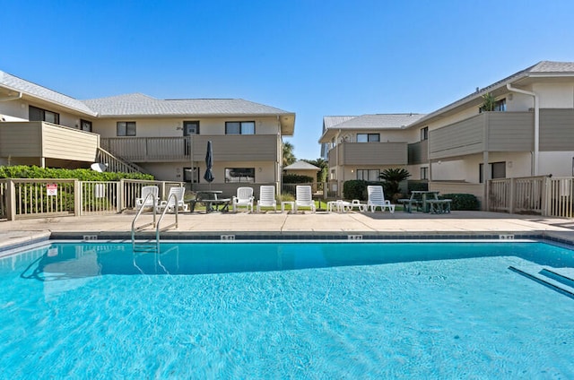 view of pool featuring a patio area