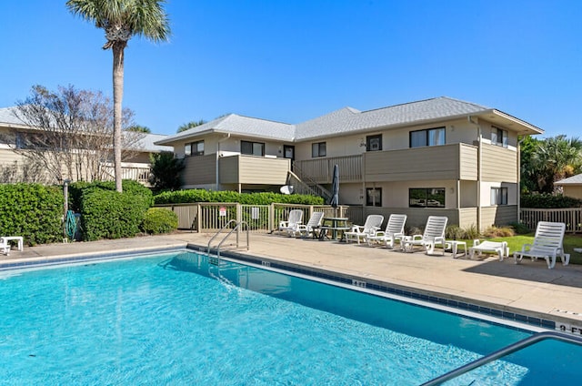 view of swimming pool with a patio area