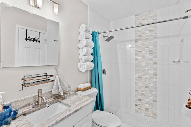 bathroom featuring vanity, toilet, and walk in shower