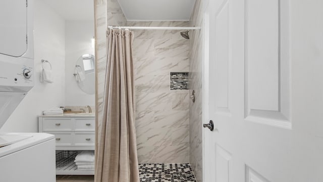 17709 Front Beach Rd Unit 2, Panama City Beach, FL 32413 - bathroom with a shower with curtain, stacked washer and dryer, and vanity