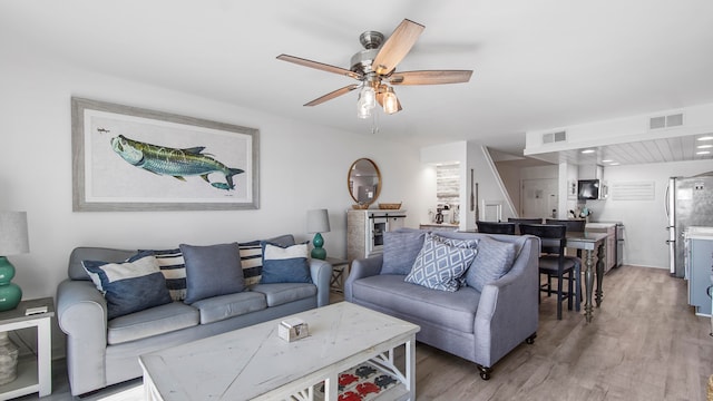 17709 Front Beach Rd Unit 2, Panama City Beach, FL 32413 - living room with hardwood / wood-style floors and ceiling fan