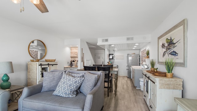 17709 Front Beach Rd Unit 2, Panama City Beach, FL 32413 - living room featuring light wood-type flooring and ceiling fan