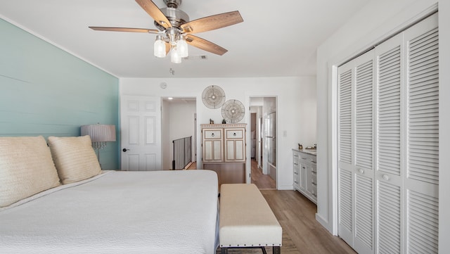 17709 Front Beach Rd Unit 2, Panama City Beach, FL 32413 - bedroom featuring a closet, ceiling fan, light hardwood / wood-style floors, and ensuite bathroom