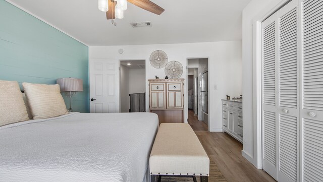 17709 Front Beach Rd Unit 2, Panama City Beach, FL 32413 - bedroom featuring ceiling fan, a closet, and hardwood / wood-style flooring