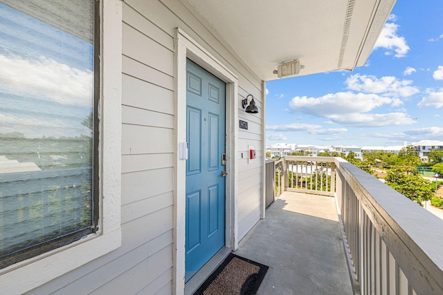 entrance to property featuring a balcony