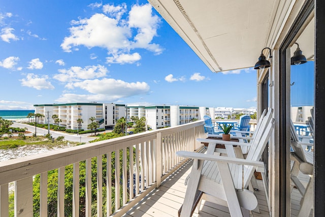 balcony featuring a water view