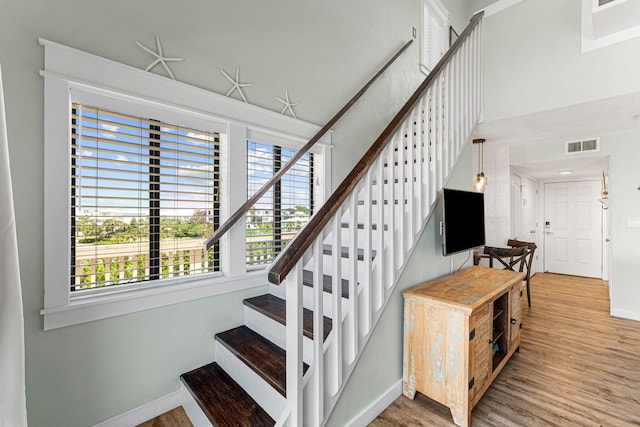 stairs with wood-type flooring