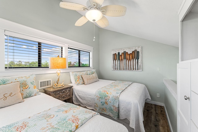 bedroom with hardwood / wood-style flooring, ceiling fan, and lofted ceiling