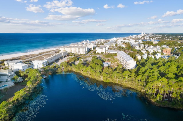 birds eye view of property featuring a water view and a view of the beach