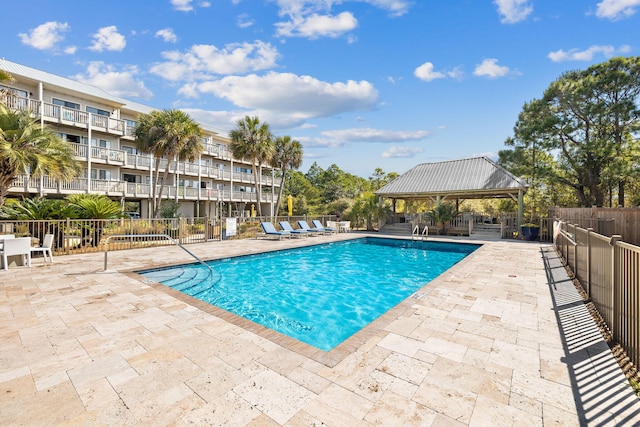 view of pool featuring a gazebo and a patio