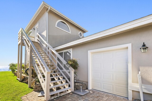 view of exterior entry featuring a garage