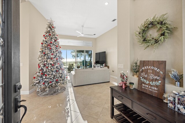 tiled living room featuring ceiling fan