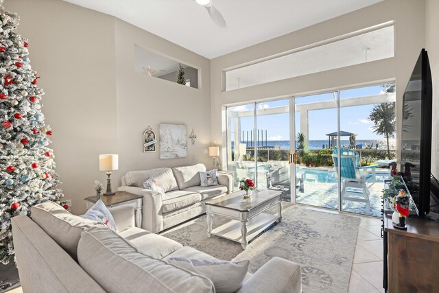 tiled living room featuring ceiling fan