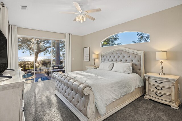 carpeted bedroom with ceiling fan, access to exterior, and multiple windows