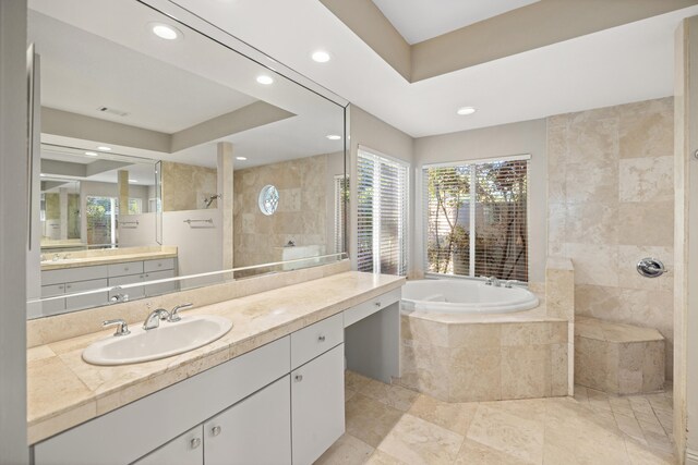 bathroom featuring vanity and plus walk in shower