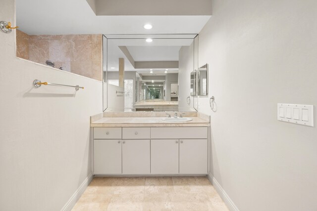 bathroom with tile patterned flooring and vanity