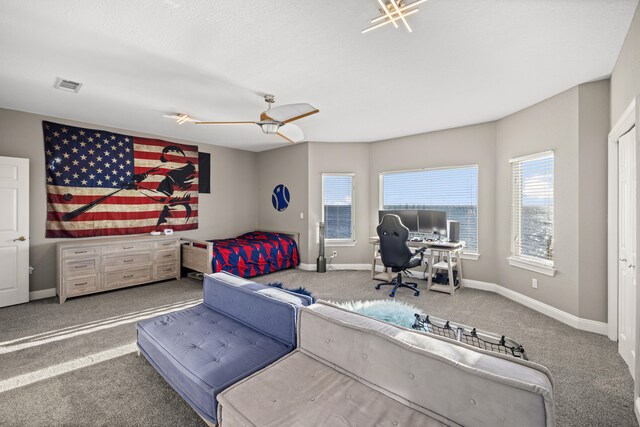 bedroom featuring ceiling fan and carpet floors