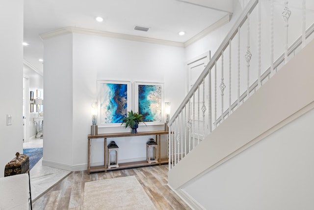 125 Emerald Rdg, Santa Rosa Beach, FL 32459 - entryway with crown molding, stairway, recessed lighting, and wood finished floors