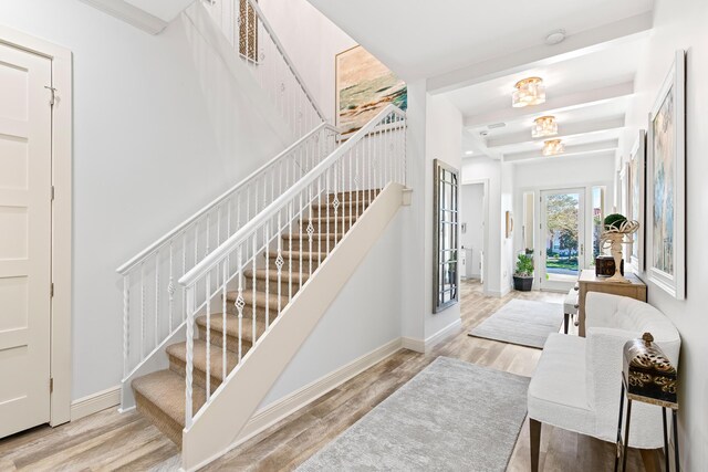 foyer featuring french doors and light wood-type flooring