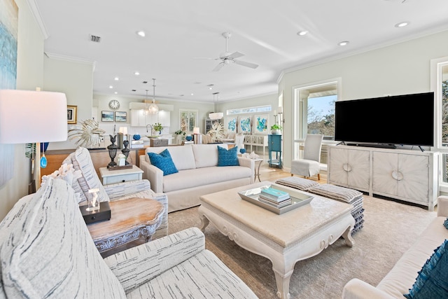 living room featuring ceiling fan, ornamental molding, and hardwood / wood-style flooring