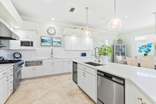 125 Emerald Rdg, Santa Rosa Beach, FL 32459 - kitchen with appliances with stainless steel finishes, beverage cooler, ornamental molding, tasteful backsplash, and a warming drawer