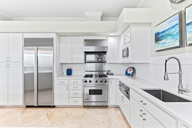 125 Emerald Rdg, Santa Rosa Beach, FL 32459 - kitchen with built in appliances, wall chimney range hood, ornamental molding, a warming drawer, and backsplash