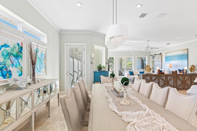 dining area featuring ceiling fan with notable chandelier and ornamental molding