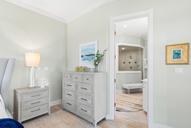 bedroom featuring light hardwood / wood-style floors and ornamental molding