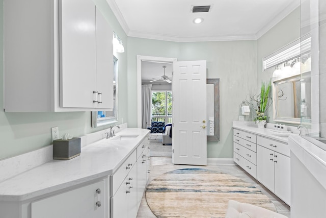 bathroom with ceiling fan, vanity, wood-type flooring, and ornamental molding