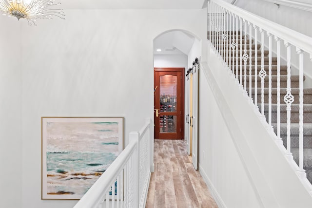 125 Emerald Rdg, Santa Rosa Beach, FL 32459 - stairway featuring wood finished floors, arched walkways, and recessed lighting