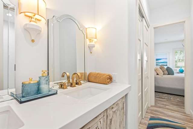 125 Emerald Rdg, Santa Rosa Beach, FL 32459 - bathroom with double vanity, wood finished floors, and connected bathroom
