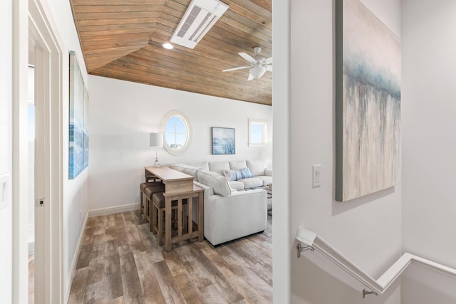 living room featuring wooden ceiling, hardwood / wood-style flooring, lofted ceiling, and ceiling fan