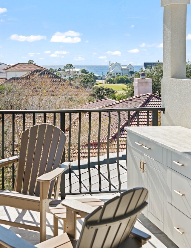 balcony featuring a water view