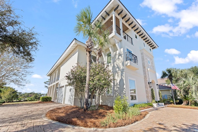 125 Emerald Rdg, Santa Rosa Beach, FL 32459 - view of property featuring an attached garage and driveway