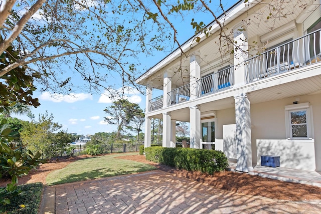 view of patio featuring a balcony